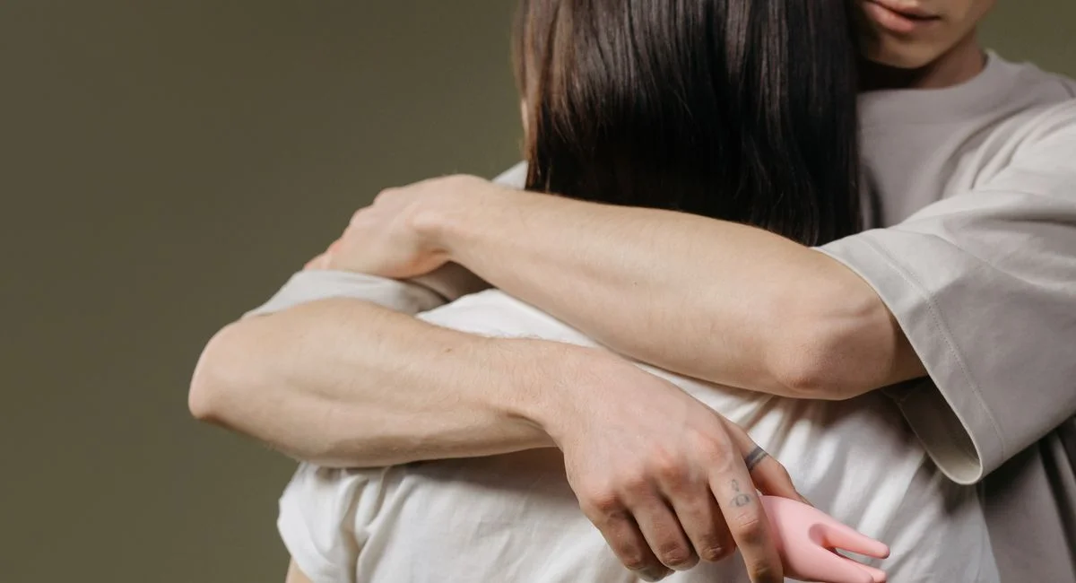 Close-up of a couple embracing, highlighting intimacy and connection.
